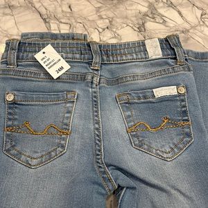 Brand new girls Seven for all mankind jeans size 24Months